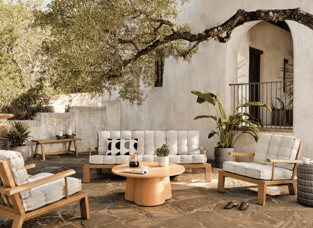 Coastal European holiday feel, reflecting Mediterranean interior design style with organic materials and sun-baked textures