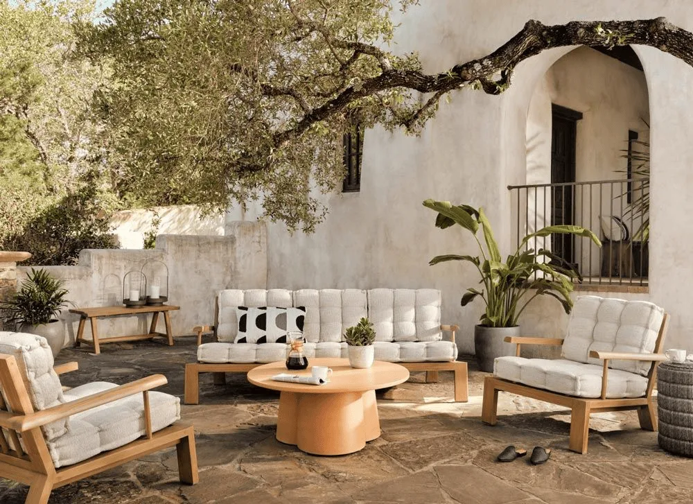 Coastal European holiday feel, reflecting Mediterranean interior design style with organic materials and sun-baked textures